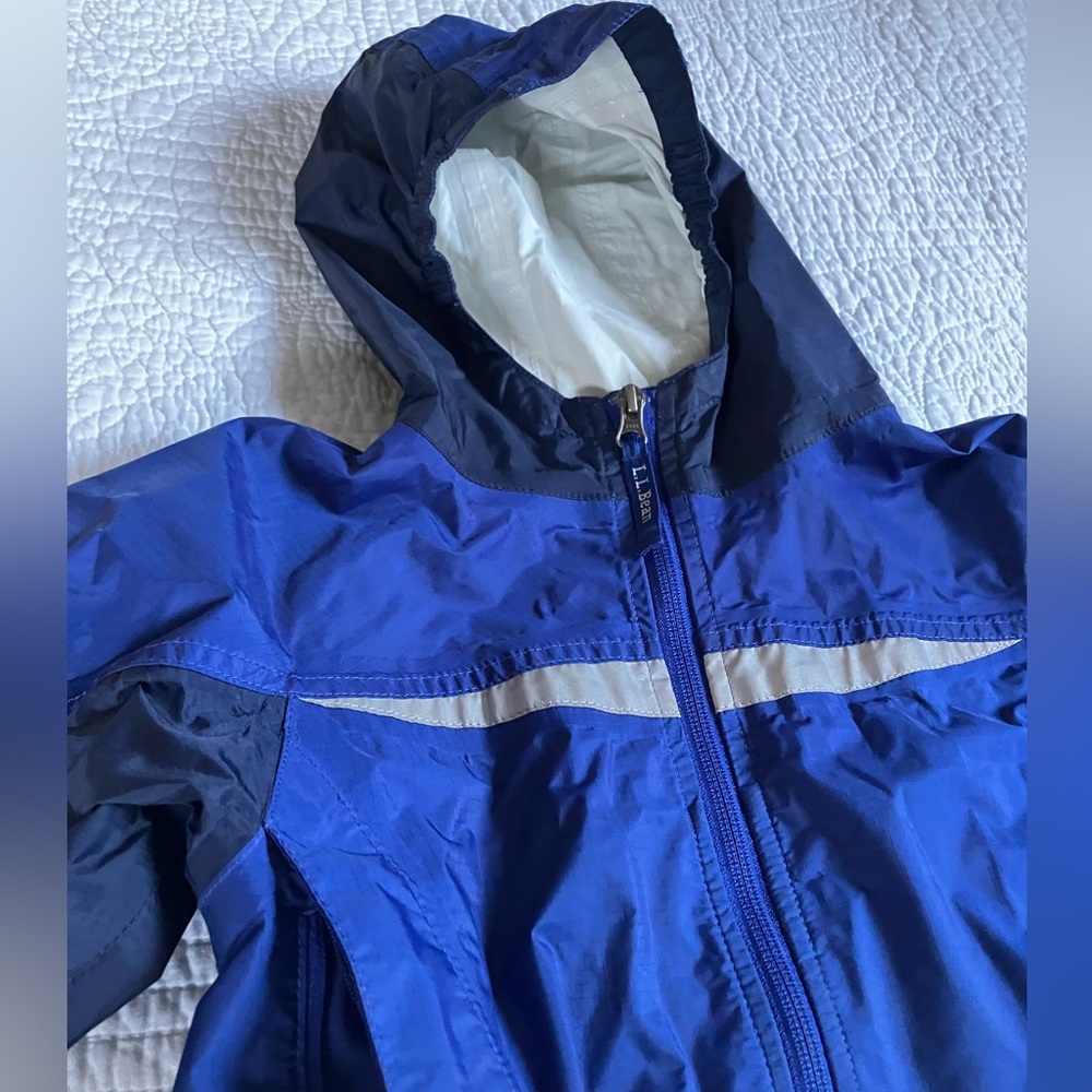 LL Bean blue rain coat size 4 with taped seams reflective details pockets